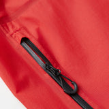 Close-up of a red jacket with a black zipper