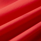 Close-up of red fabric with a textured surface